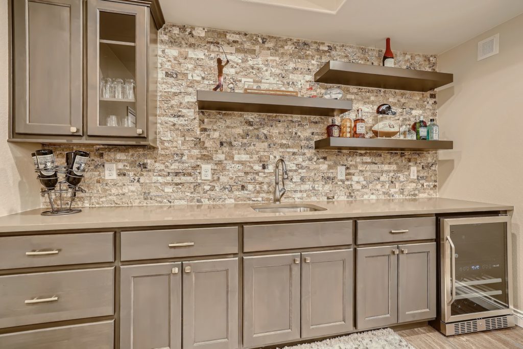 View one of Finished Basements & More by Sheffield Homes' basement's wet bar: FB21014. Contact us to schedule a free consultation for your basement finishing project.