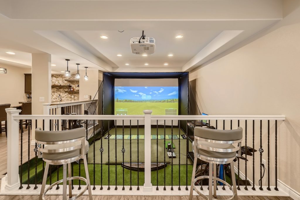 View one of Finished Basements & More by Sheffield Homes' basement's golf simulators: FB21014. Contact us to schedule a free consultation for your basement finishing project.